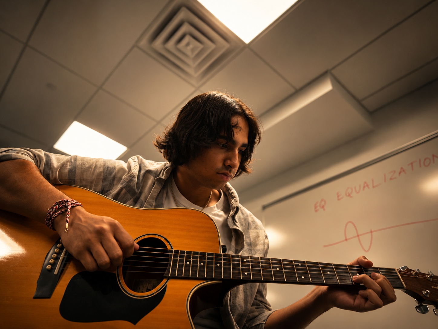 Zain Bari with guitar